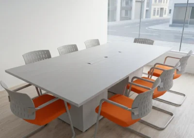 Mesa de reunión ejecutiva en acabado wengué oscuro con sistema de conectividad integrado de Tamasa.